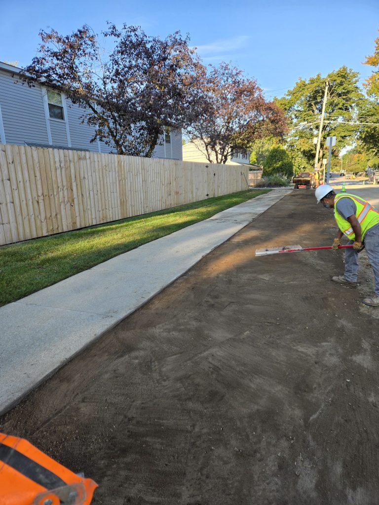 TAW Landscape employee gives the final touches; site restoration gallery